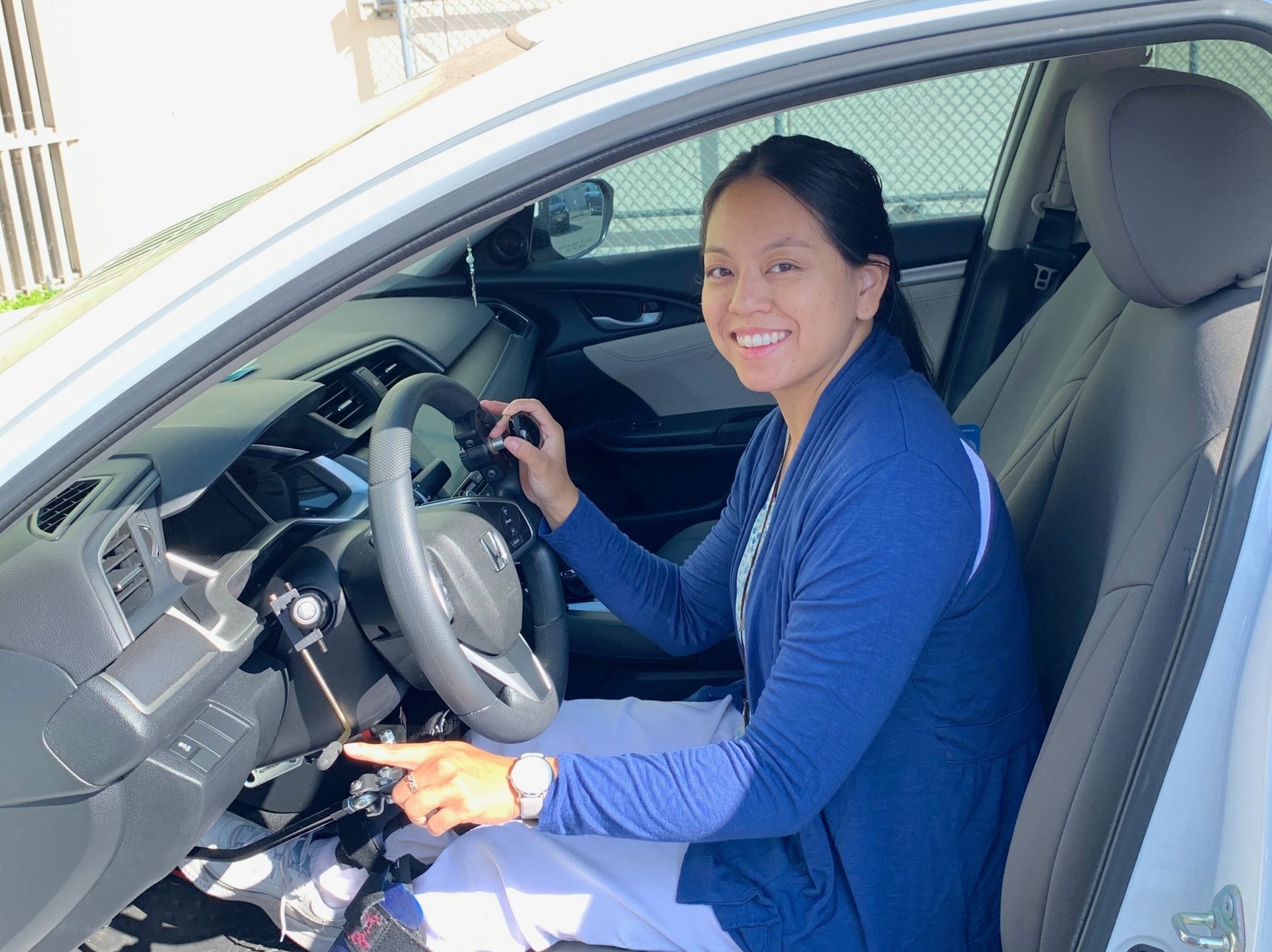 Clarice in car showing the handcontrols